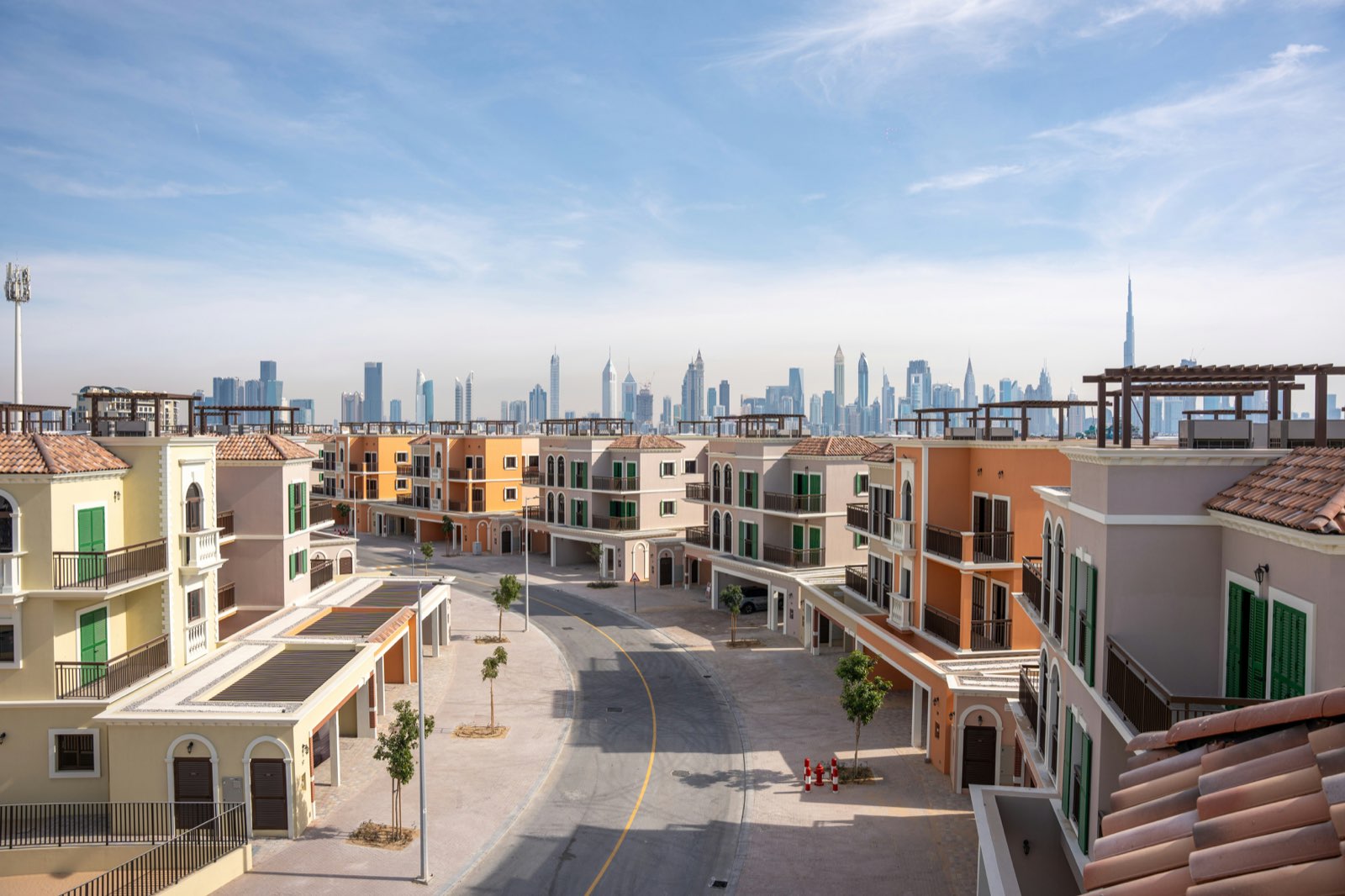 A Dubai residential community with the Downtown skyline behind it